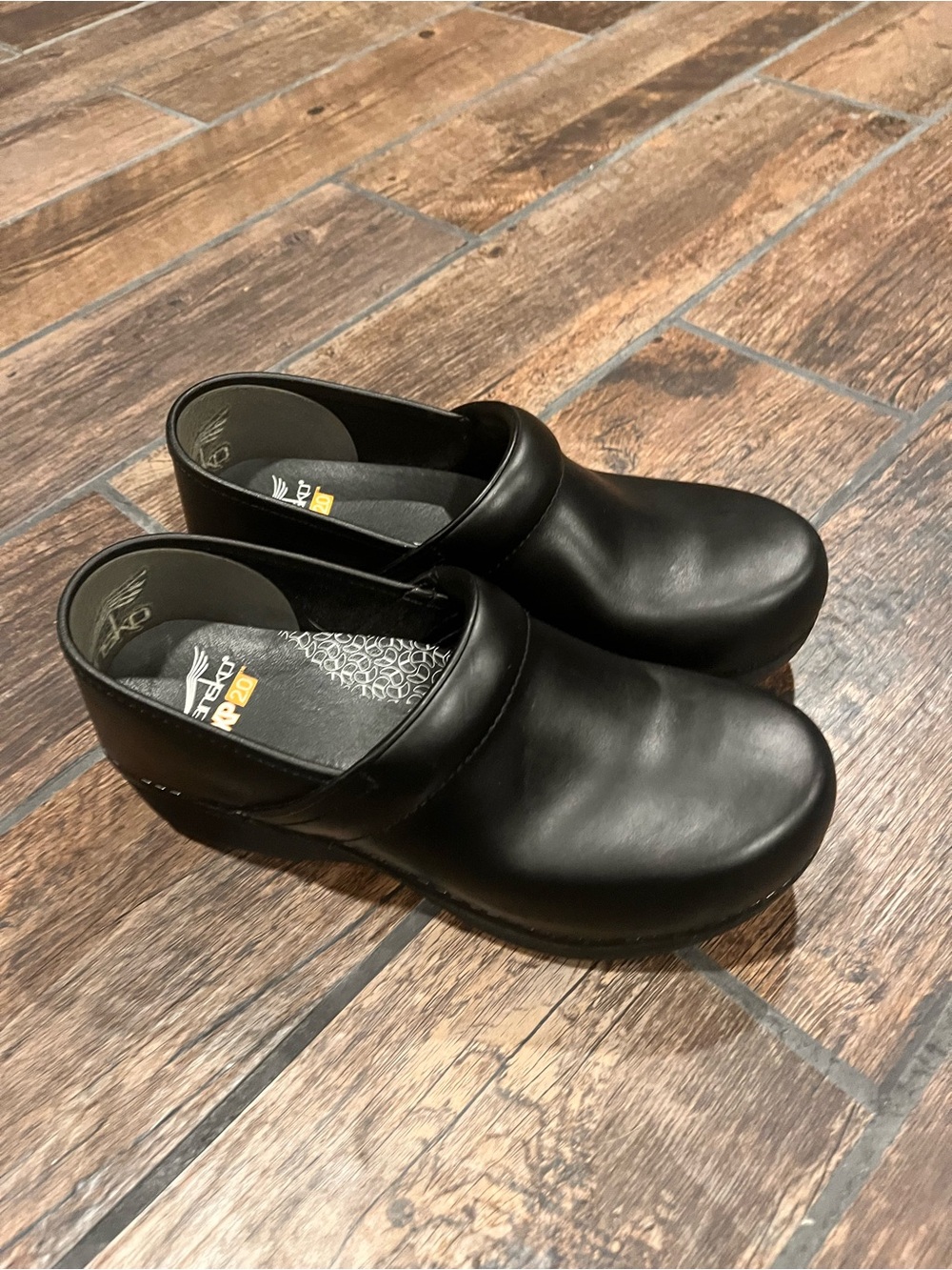 Dansko Black Leather Slip-On Clogs for Men